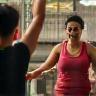 Harpreet high-fiving a class instructor